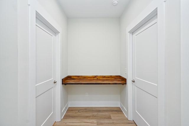 spacious closet featuring light hardwood / wood-style floors