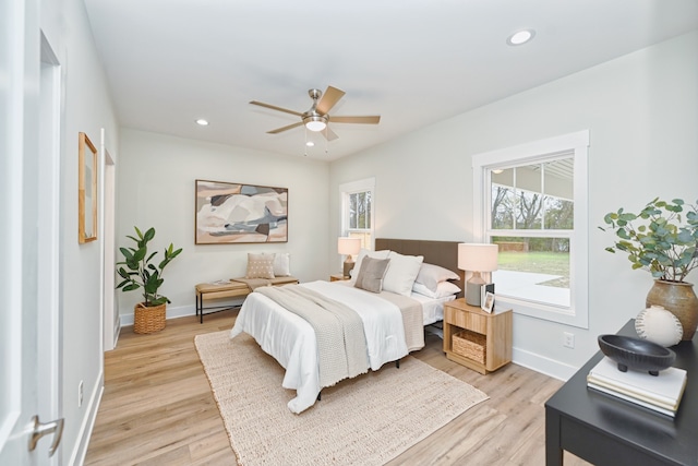 bedroom featuring light hardwood / wood-style flooring and ceiling fan