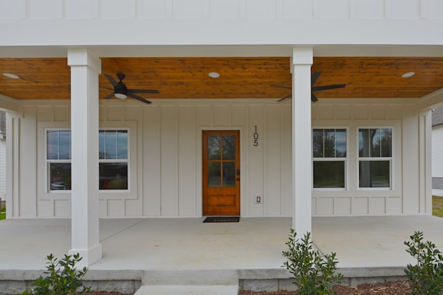 entrance to property with ceiling fan and a porch