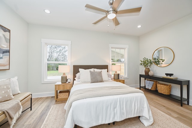 bedroom featuring ceiling fan and light hardwood / wood-style floors