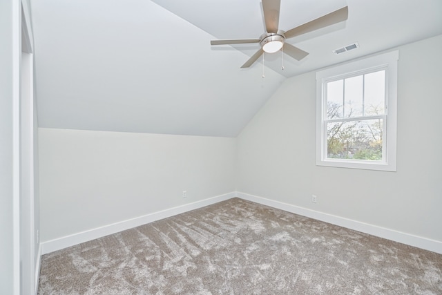 bonus room with light colored carpet, ceiling fan, and lofted ceiling