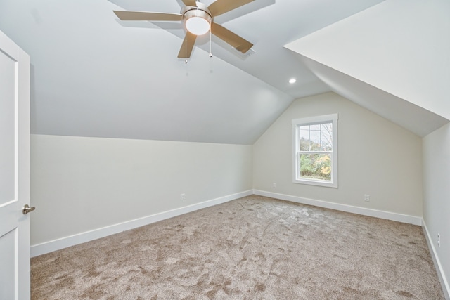 bonus room with light carpet, vaulted ceiling, and ceiling fan