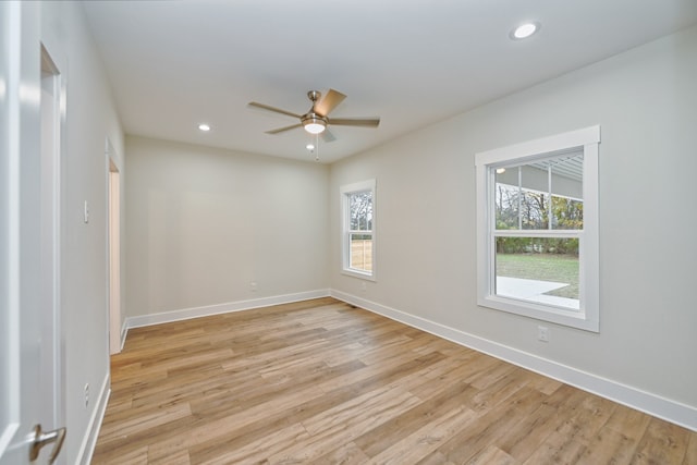 unfurnished room featuring ceiling fan and light wood-type flooring