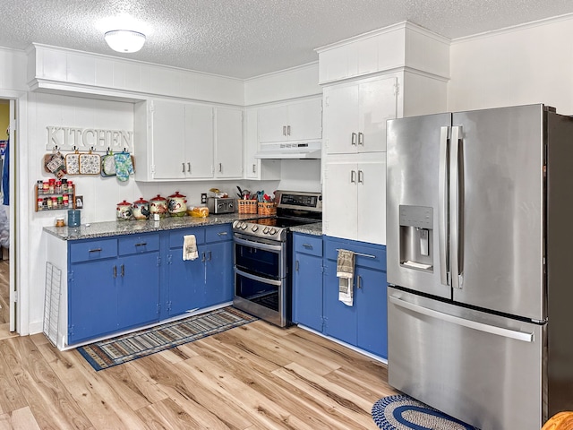 kitchen featuring blue cabinetry, white cabinets, light wood-style floors, under cabinet range hood, and appliances with stainless steel finishes