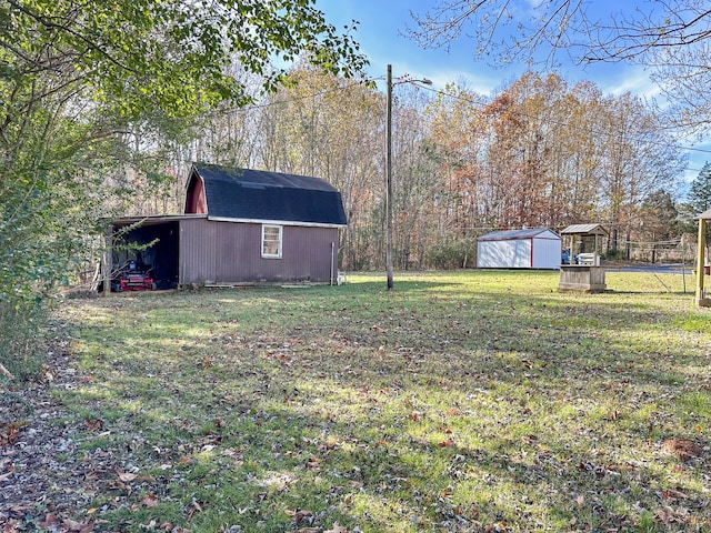 view of yard featuring an outbuilding and a shed