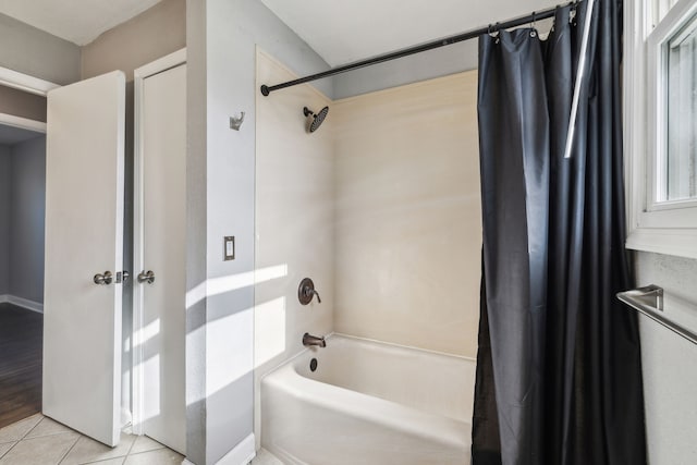 bathroom featuring tile patterned flooring and shower / bath combo