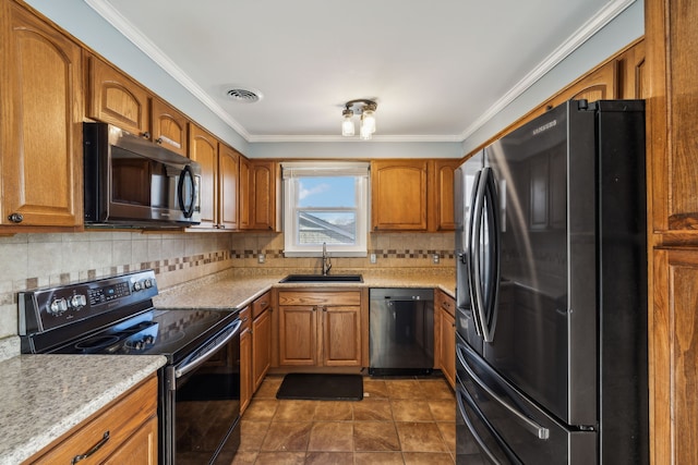 kitchen with black appliances, backsplash, ornamental molding, and sink