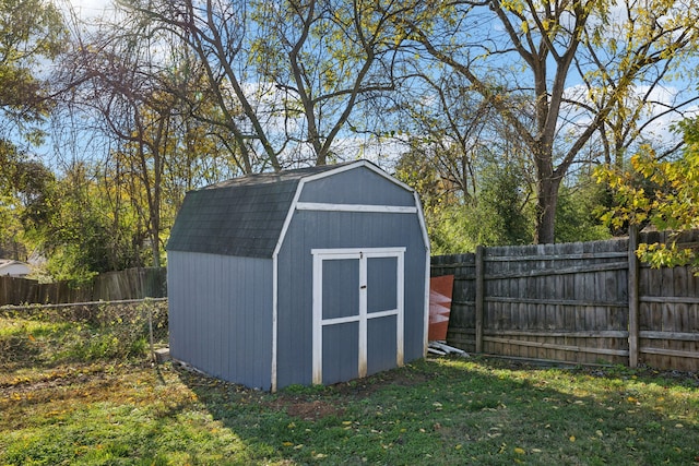 view of outdoor structure featuring a lawn