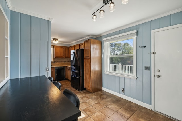 kitchen featuring black appliances, decorative backsplash, light tile patterned flooring, and crown molding