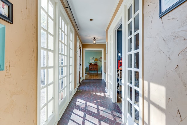 hall featuring ornamental molding and french doors