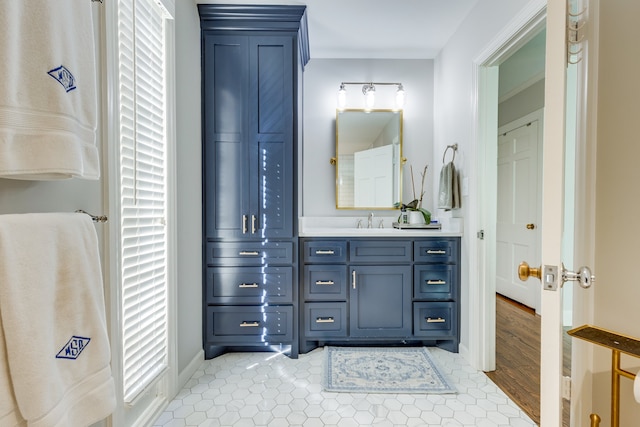 bathroom with vanity and hardwood / wood-style flooring