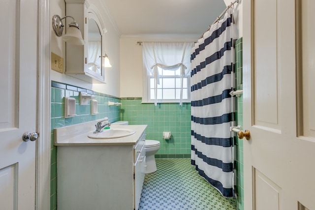 bathroom featuring a shower with curtain, toilet, vanity, tile walls, and ornamental molding