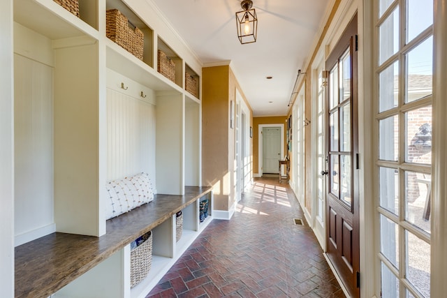 mudroom with crown molding