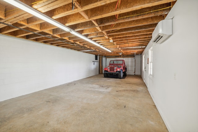 garage with a wall mounted air conditioner