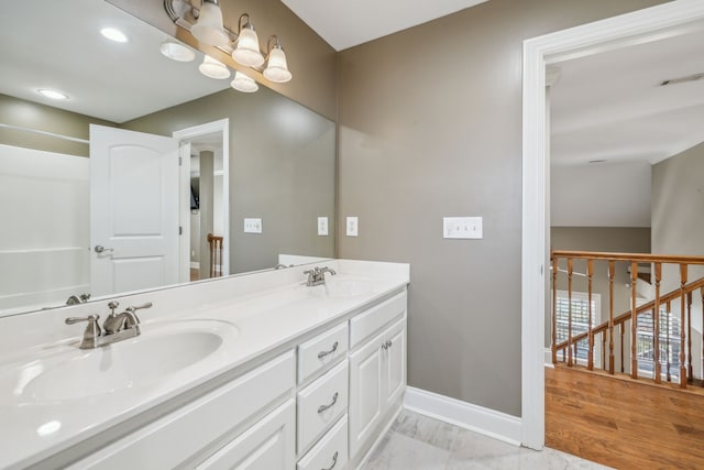 bathroom with hardwood / wood-style flooring and vanity