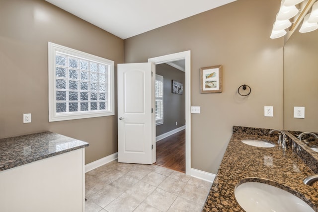 bathroom with tile patterned floors and vanity