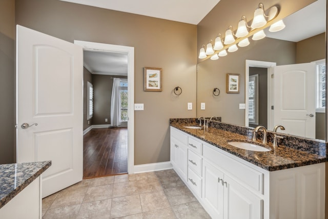 bathroom with hardwood / wood-style floors and vanity