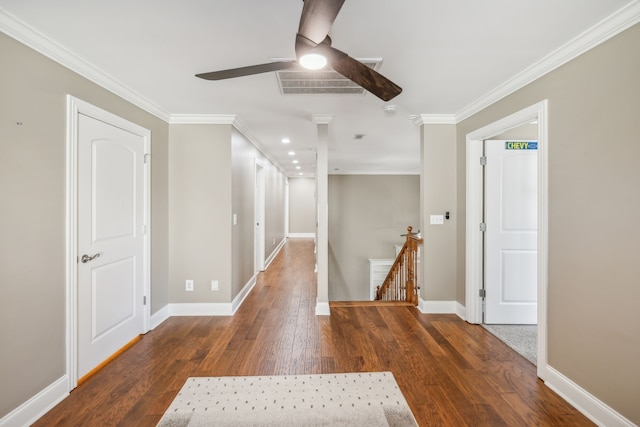 corridor featuring dark hardwood / wood-style flooring and ornamental molding