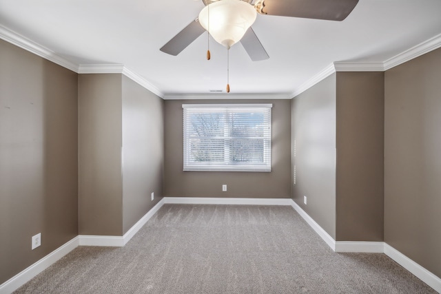 spare room with carpet, ceiling fan, and ornamental molding