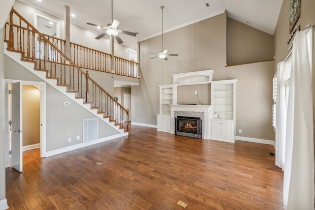 unfurnished living room with dark hardwood / wood-style floors, high vaulted ceiling, and ceiling fan