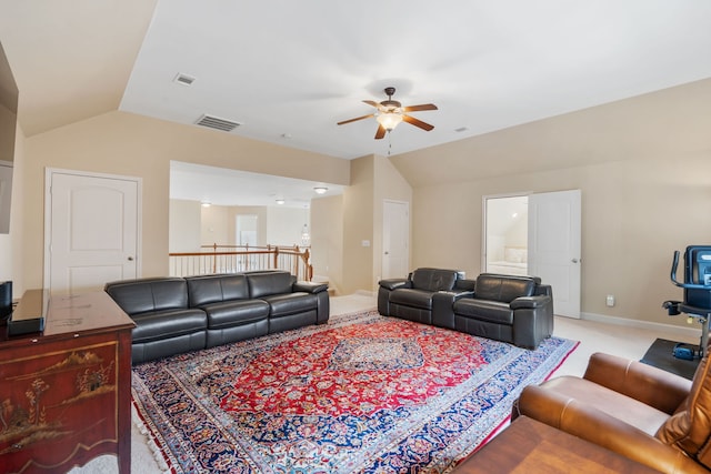 carpeted living room featuring ceiling fan and lofted ceiling