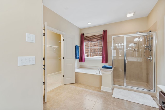 bathroom featuring tile patterned flooring, vanity, and shower with separate bathtub