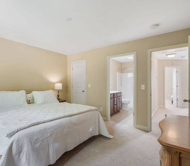 carpeted bedroom with ensuite bath