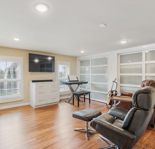 sitting room featuring light hardwood / wood-style flooring