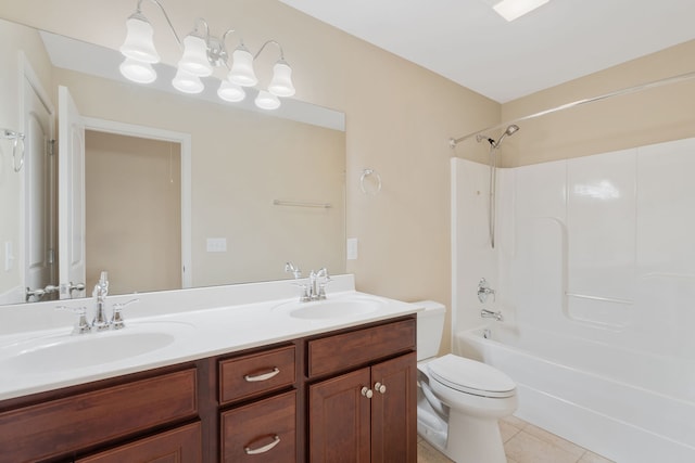 full bathroom with tile patterned floors, vanity, toilet, and washtub / shower combination