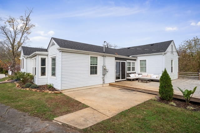 back of property with a yard, an outdoor hangout area, and a wooden deck