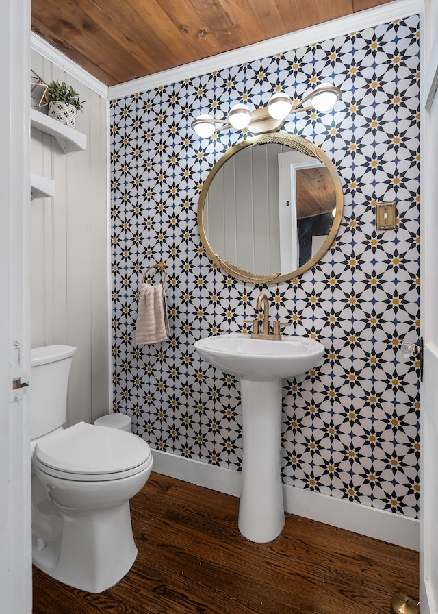 bathroom featuring crown molding, wood-type flooring, tile walls, wooden ceiling, and toilet