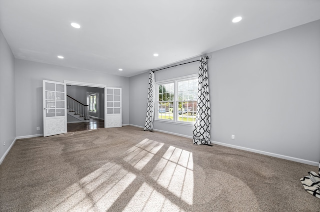 unfurnished living room with carpet