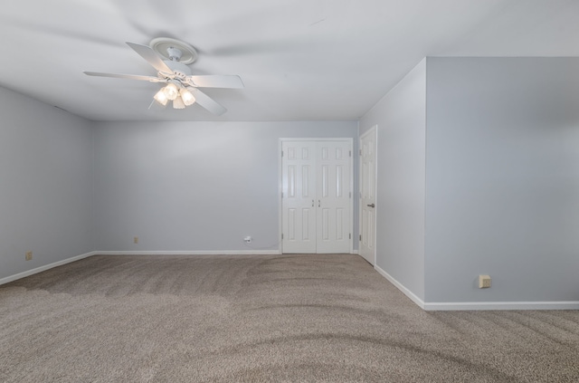 unfurnished room featuring carpet flooring and ceiling fan