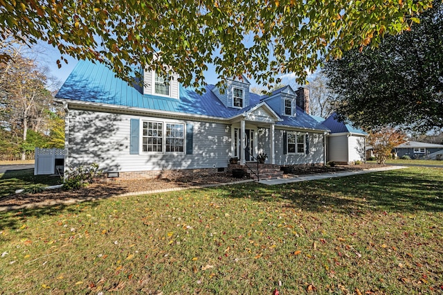 cape cod house with a front yard