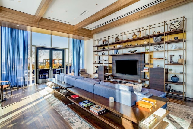 living room with beamed ceiling, wood-type flooring, and french doors