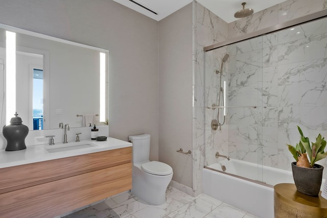 full bathroom with combined bath / shower with glass door, vanity, and toilet