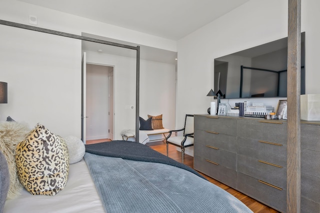 bedroom with wood-type flooring