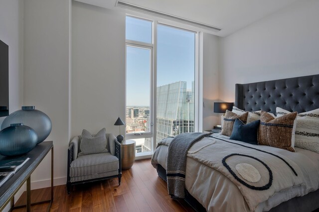 bedroom featuring dark wood-type flooring