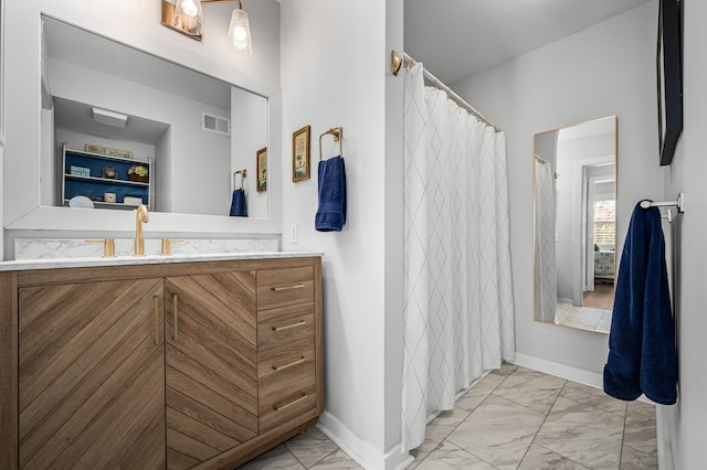 bathroom with vanity and walk in shower