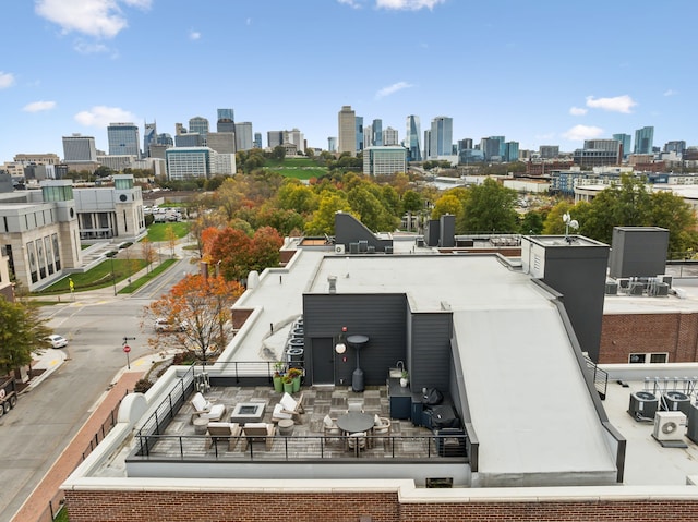 drone / aerial view featuring a city view