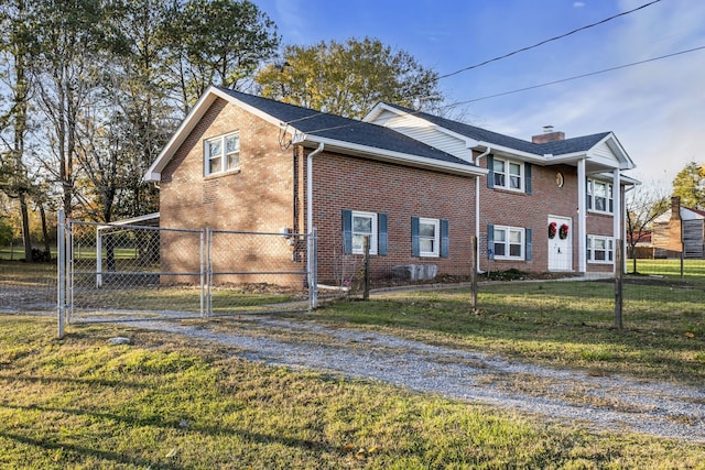 view of side of home with a lawn