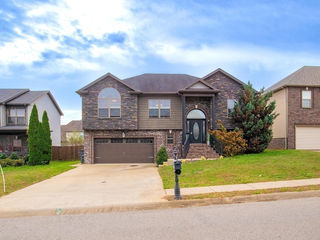 view of front of house with a garage and a front yard