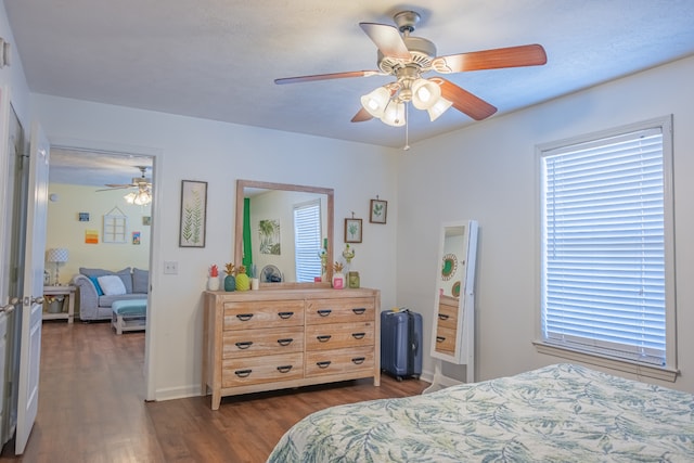 bedroom featuring dark hardwood / wood-style floors and ceiling fan