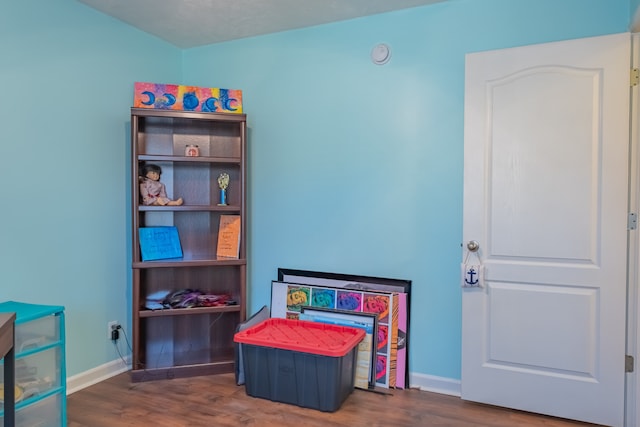 game room featuring dark hardwood / wood-style floors