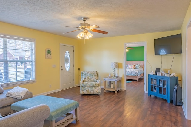 353 Oak Hollow Rd, Manchester, TN 37355 - living area featuring a ceiling fan, dark wood-type flooring, and a textured ceiling