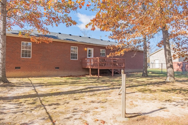 rear view of house featuring a deck