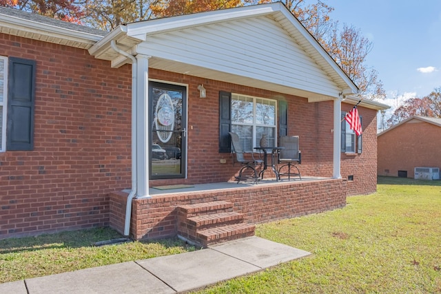 353 Oak Hollow Rd, Manchester, TN 37355 - property entrance featuring covered porch, a lawn, and brick siding
