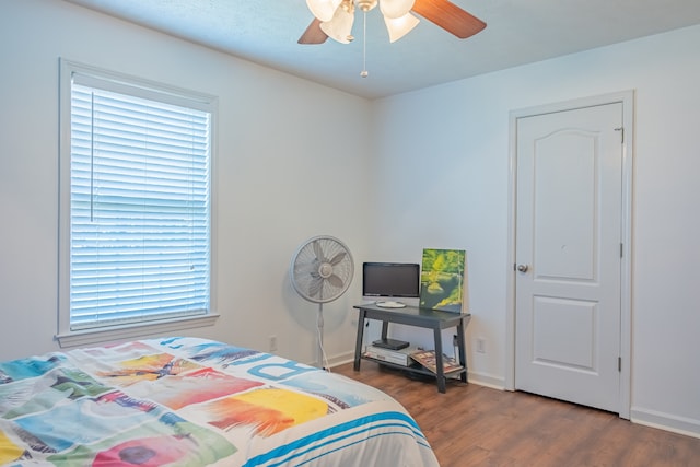 bedroom with ceiling fan and wood-type flooring