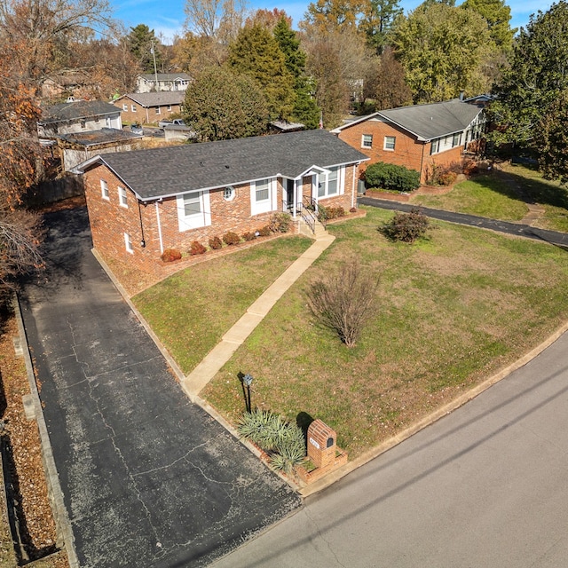 ranch-style home with a front lawn