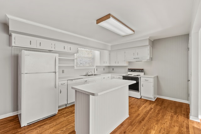 kitchen with a center island, white cabinetry, white appliances, and light hardwood / wood-style flooring